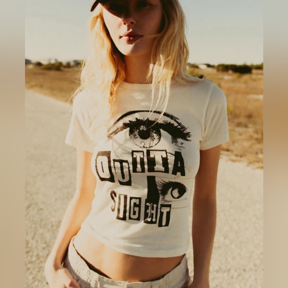 Urban Outfitters “Outta Sight” baby-doll cropped T